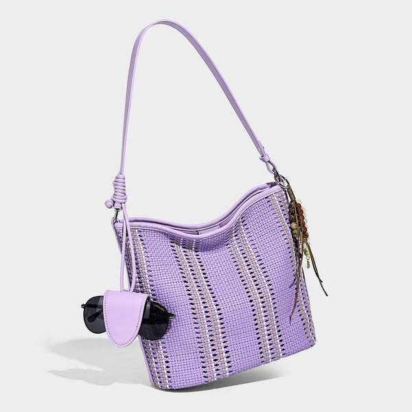 Woven bucket shoulder bag with leather-look trim, silver-tone hardware, and beaded tassel charm, detail view 7