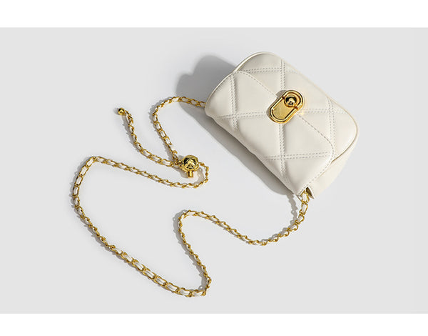 Compact diamond-quilted mini crossbody bag with gold-tone turn-lock closure and woven chain strap, detail view 9