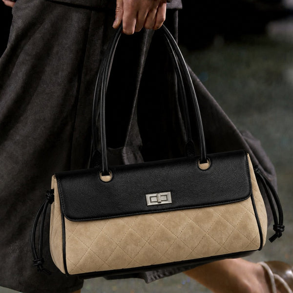 Compact two-tone quilted shoulder bag with black leather-look flap, silver turn-lock clasp, diamond-quilted body, side