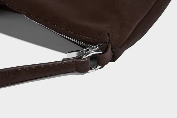 Slouchy matte-finish hobo shoulder bag with tassel cords, silver-tone hardware, and faux-fur pom charm, detail view 20
