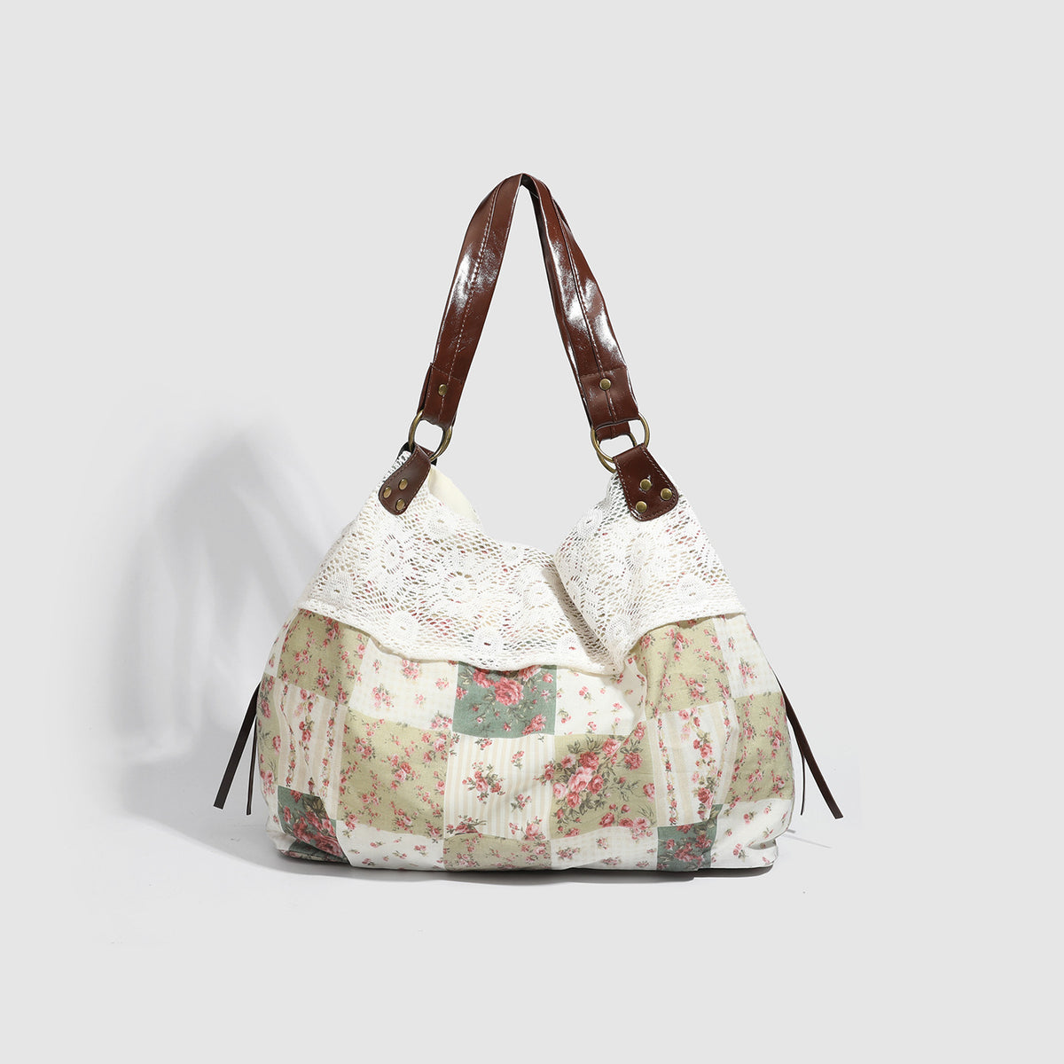Cream floral patchwork hobo tote bag with crochet lace trim and brown leather-look shoulder straps, detail view 3