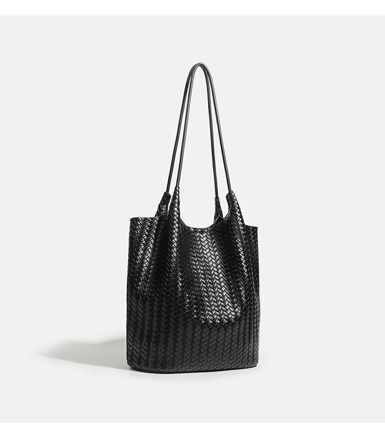 Large woven textured tote bag with long shoulder straps and structured rectangular base, detail view 11