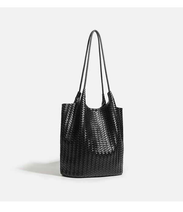 Large woven textured tote bag with long shoulder straps and structured rectangular base, detail view 11
