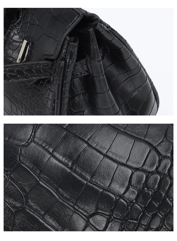Croc-embossed structured trapezoid satchel with silver turn-lock hardware, rounded top handles, and detachable shoulder