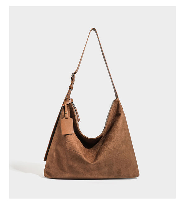 Slouchy croc-embossed matte hobo shoulder bag with adjustable strap and top zip closure, detail view 16