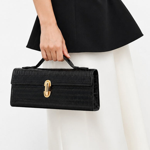 Strukturierte rechteckige Clutch mit Überschlag, schmalem Tragegriff und ovalem Drehverschluss in Goldoptik, Detailansicht 3