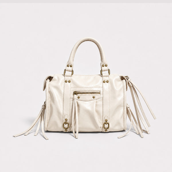 Structured glossy leather-look satchel bag with brass-tone studs, side tassel fringe, dual top handles, and front zip pocket