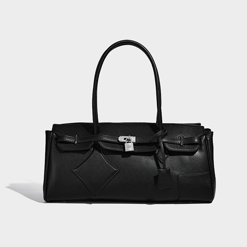 Structured black leather-look tote bag with padlock turn-lock hardware, decorative strap detailing, and rounded double top