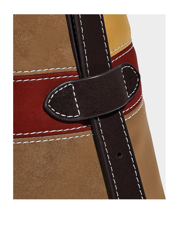 Patchwork bucket tote shoulder bag with tan, dark brown, olive, red, and sky blue color-block panels, white contrast, detail