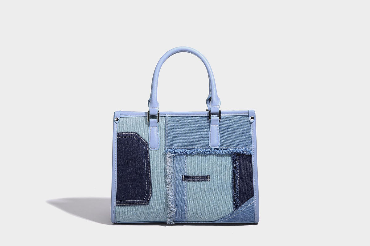 Structured patchwork denim tote bag with frayed panel seams, dual top handles, and silver-tone hardware, detail view 15