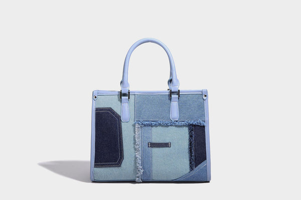 Structured patchwork denim tote bag with frayed panel seams, dual top handles, and silver-tone hardware, detail view 15