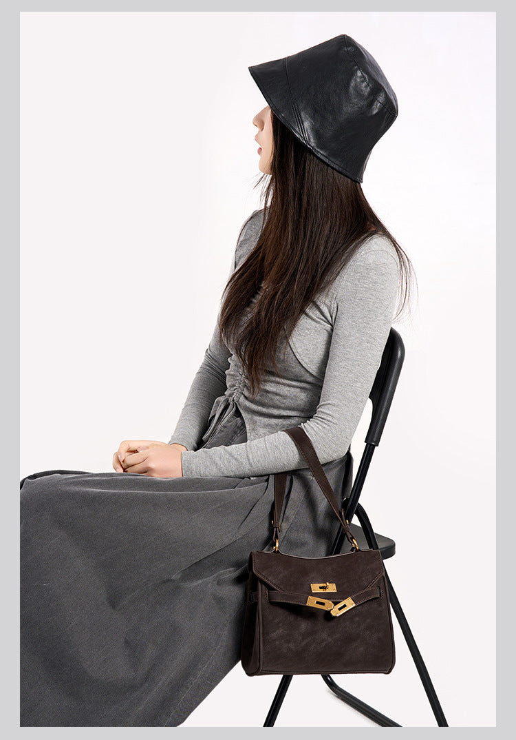 Structured dark brown flap satchel with gold-tone turn-lock hardware and detachable shoulder strap, detail view 12