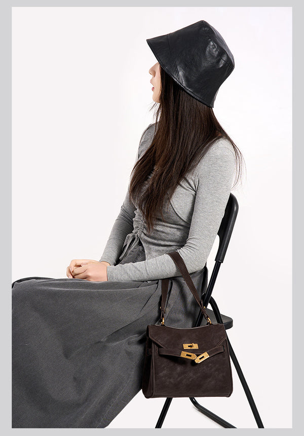 Structured dark brown flap satchel with gold-tone turn-lock hardware and detachable shoulder strap, detail view 12