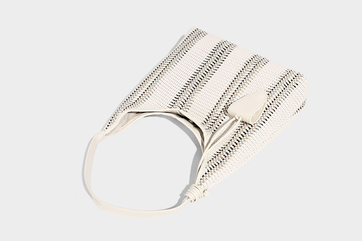 Woven striped slouch shoulder tote bag with knotted strap and attached front flap pouch, detail view 24