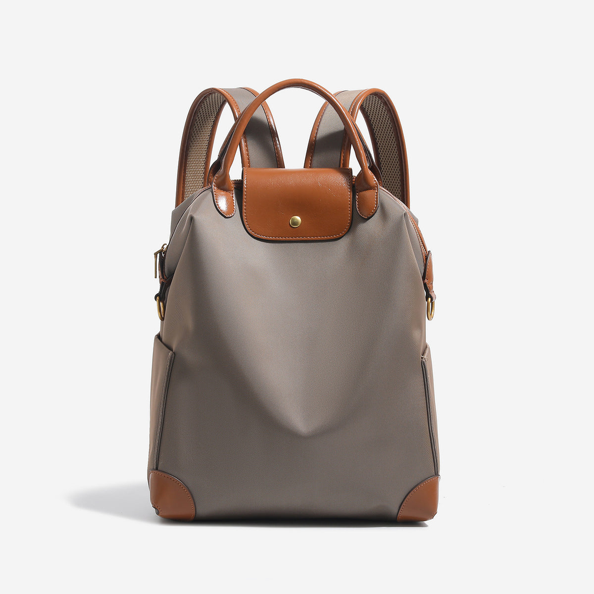 Large matte nylon backpack handbag with cognac leather-look trim, snap flap, and gold-tone hardware, detail view 8