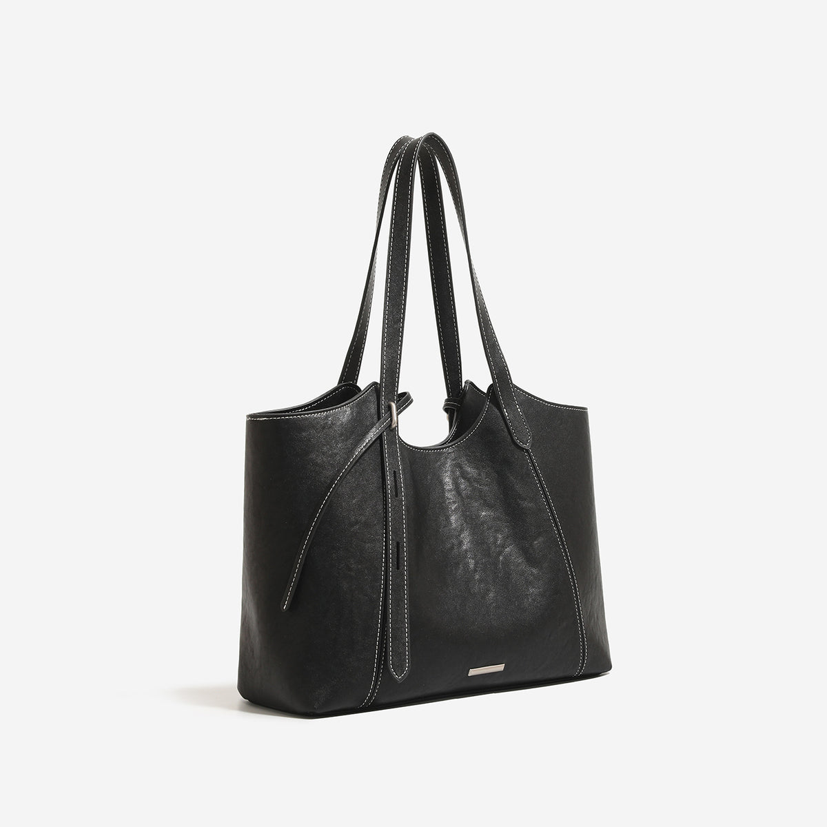 Structured leather-look tote bag with tall dual shoulder straps, front tie detail, contrast white topstitching, and, front