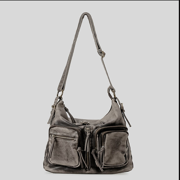 Distressed gunmetal gray hobo shoulder bag with multiple front zip pockets and adjustable crossbody strap, detail view 7