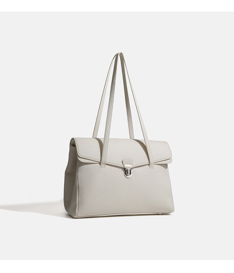 Structured black pebbled-finish flap tote bag with silver turn-lock clasp and long double shoulder straps, detail view 12