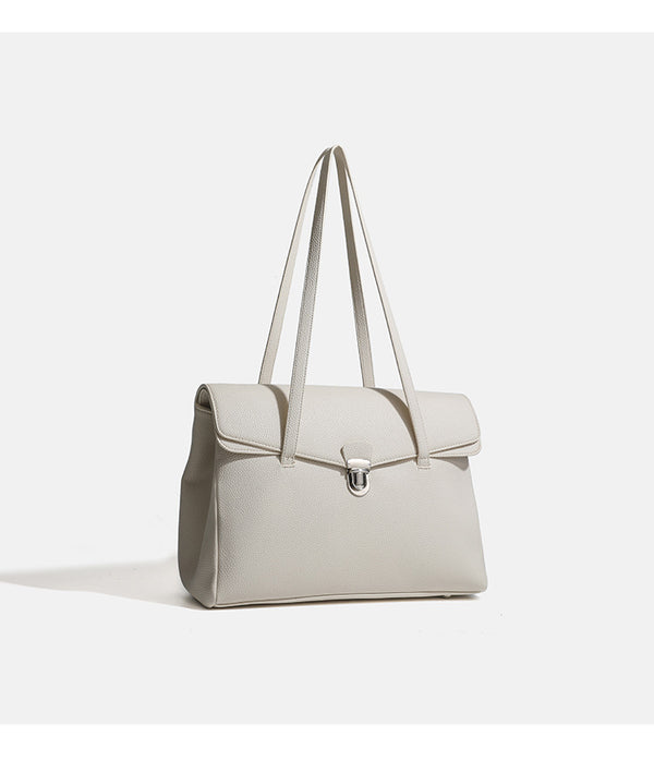 Structured black pebbled-finish flap tote bag with silver turn-lock clasp and long double shoulder straps, detail view 12