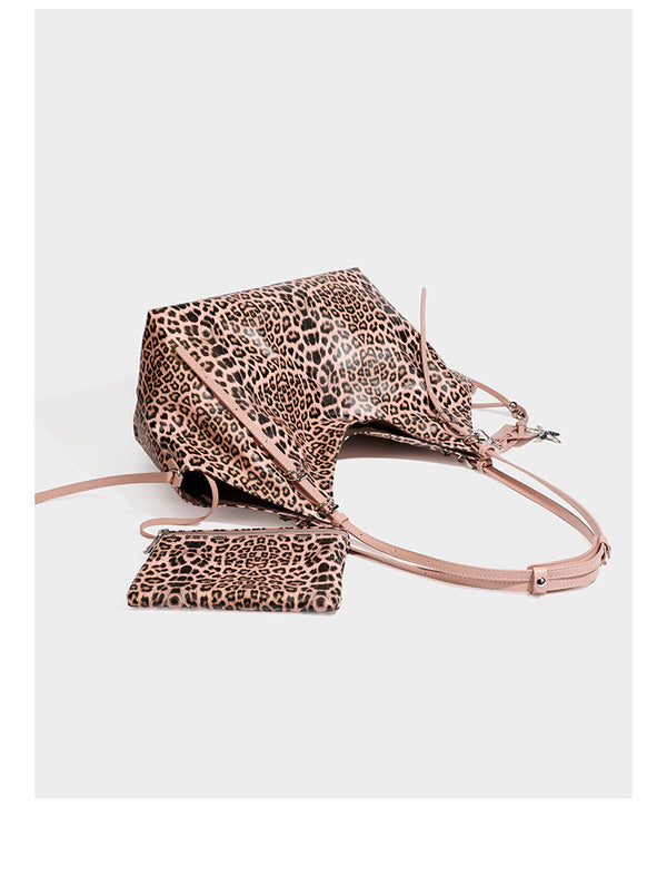 Large leopard print shoulder tote bag with glossy finish, long double straps, front zip pocket, silver-tone hardware, and