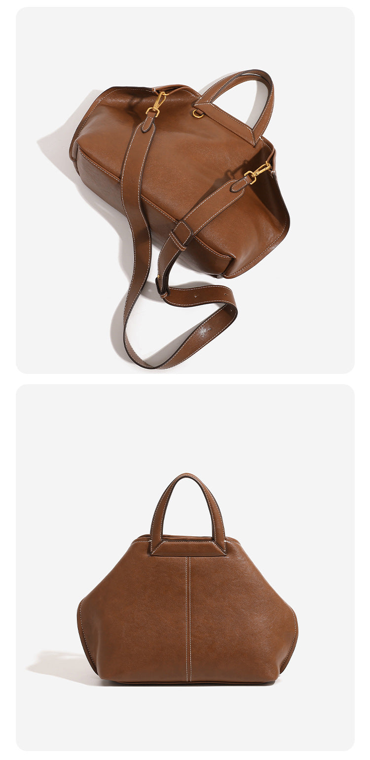 Structured cognac brown leather-look tote bag with fold-ear side panels, top handles, gold-tone hardware, and detachable