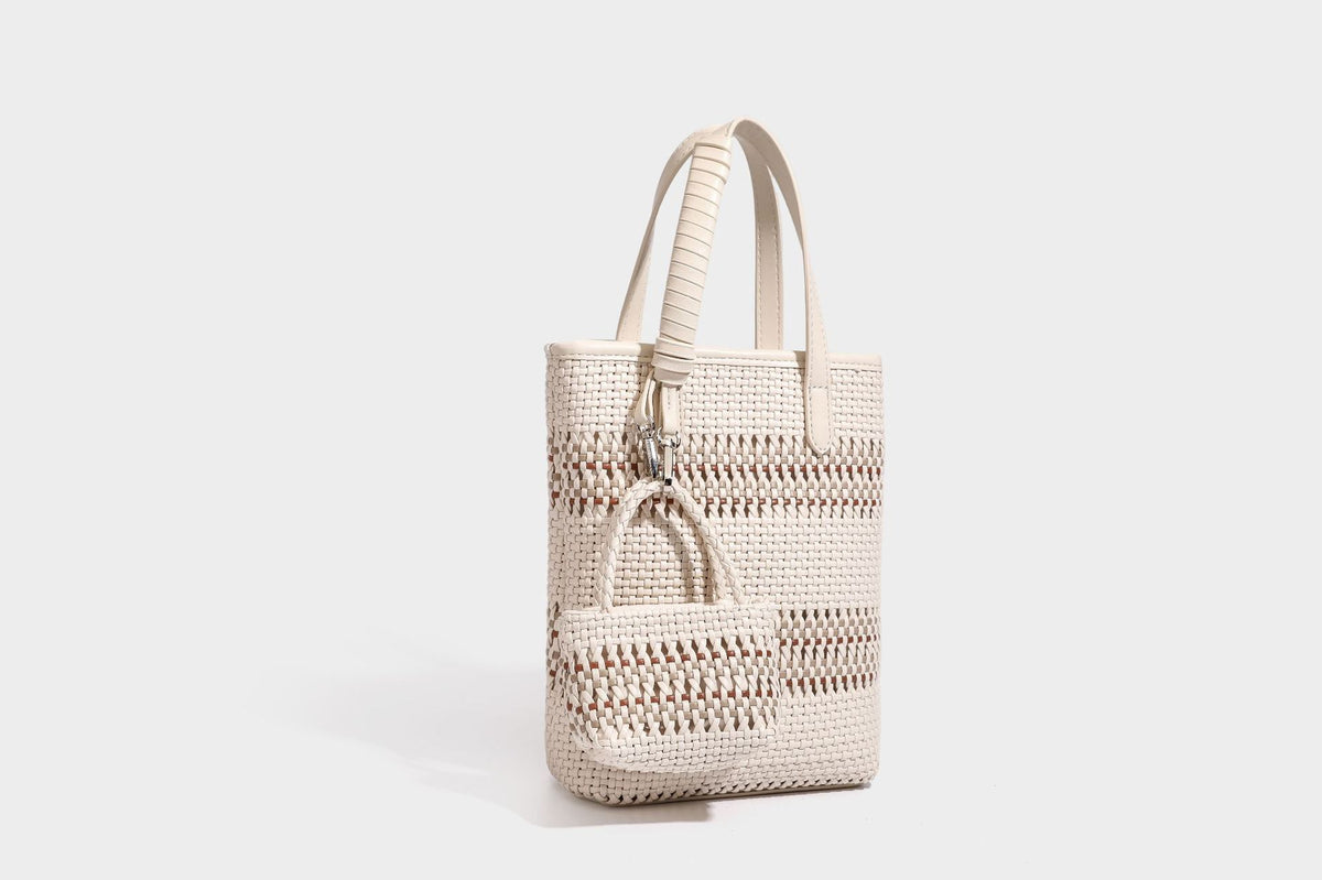Kleine, formstabile Korb-Shopper-Tasche aus geflochtenem Material mit umwickelten Griffen in Lederoptik und silberfarbenen Verschlussbeschlägen, Detailansicht 32