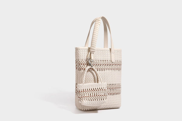 Kleine, formstabile Korb-Shopper-Tasche aus geflochtenem Material mit umwickelten Griffen in Lederoptik und silberfarbenen Verschlussbeschlägen, Detailansicht 32