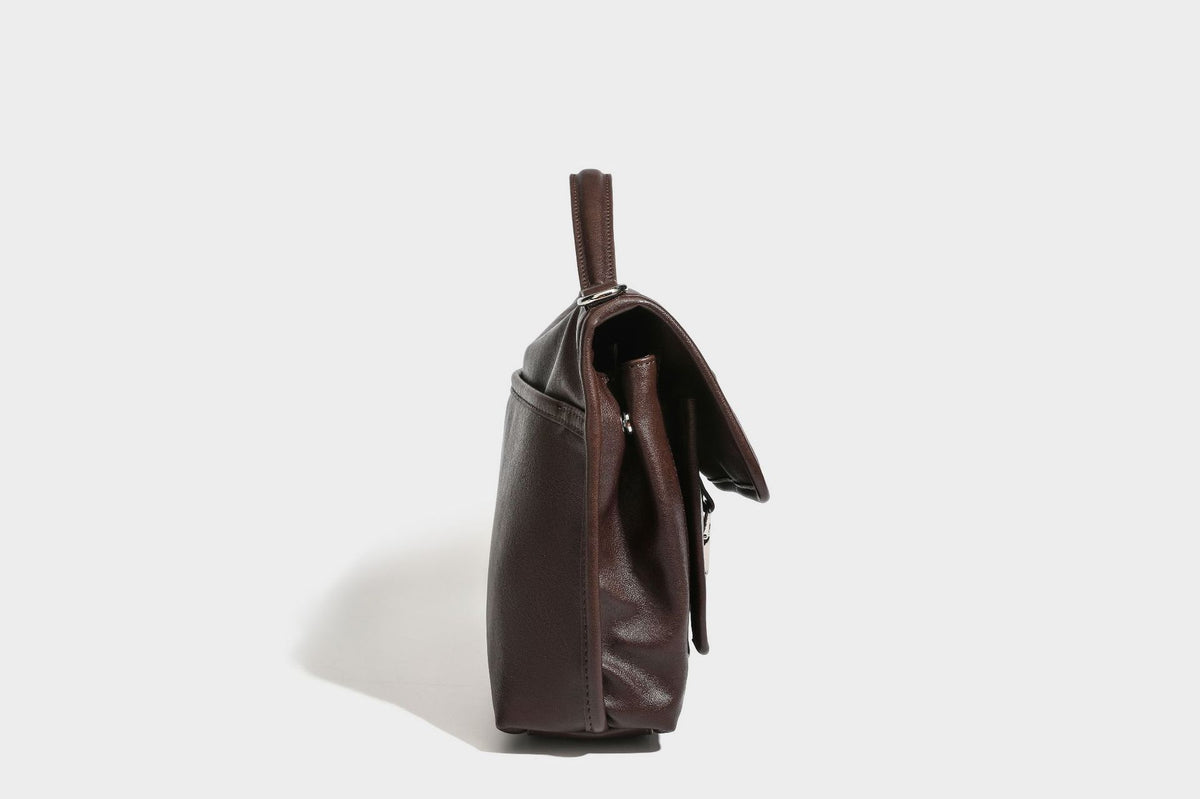 Structured rectangular satchel bag in dark espresso brown with smooth leather-look finish, flap front with silver turn-lock