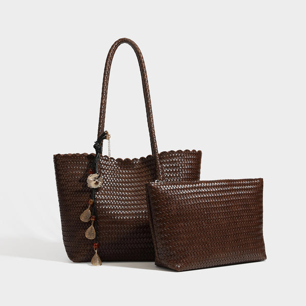Large open-top woven leather-look tote bag in dark brown with scalloped edge, braided double shoulder straps, and decorative