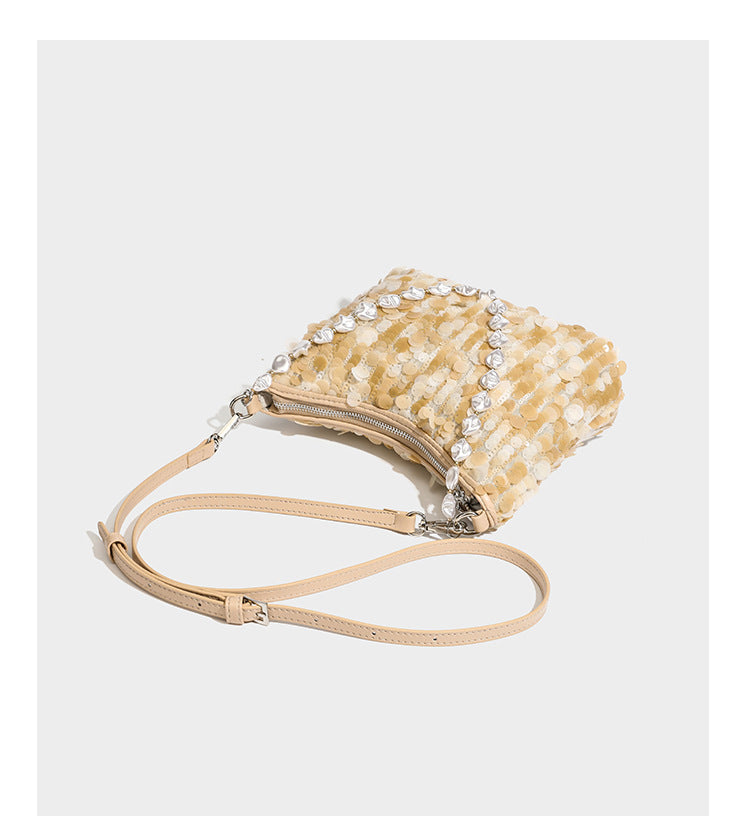 Champagne and ivory large-disc sequin shoulder bag with baroque faux-pearl beaded chain strap and silver-tone zip closure
