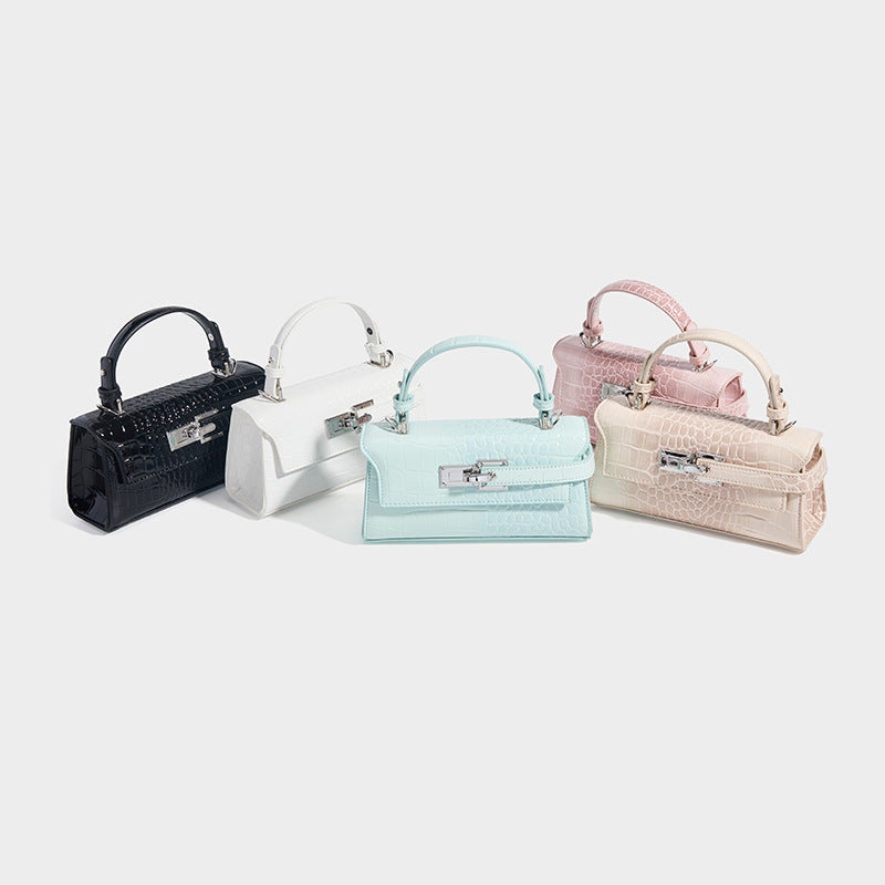 Mini structured croc-embossed top-handle satchel with silver-tone turn-lock closure and detachable shoulder strap, detail