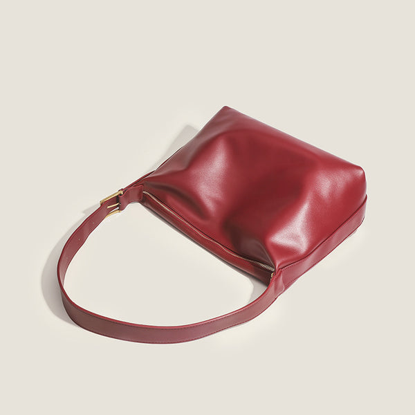 Large slouchy hobo shoulder bag in smooth leather-look finish with single long strap and gold-tone zip closure, detail view 4