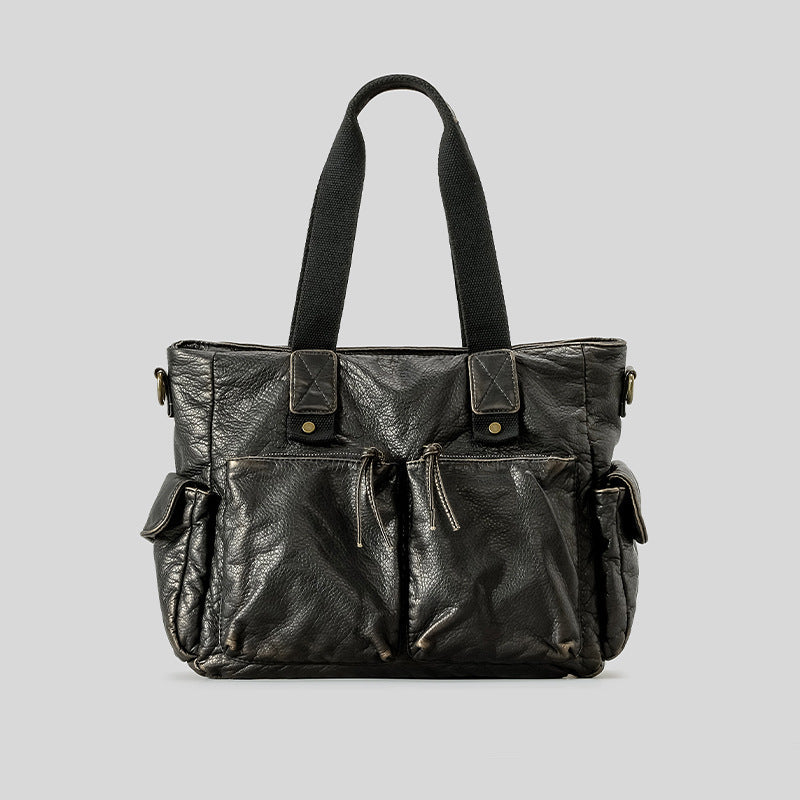 Slouchy crinkled pebbled leather-look convertible tote bag in gunmetal black with woven top handles, adjustable shoulder
