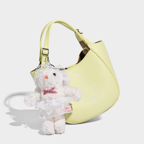 Small pebbled half-moon shoulder bag with dual top handles, detachable crossbody strap, and silver-tone hardware, detail view