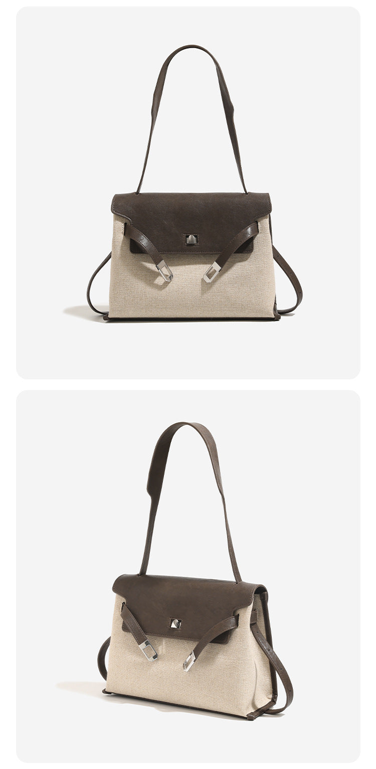 Structured trapezoidal flap satchel bag with silver-tone turn-lock clasp, decorative front strap tabs, gusseted sides, and