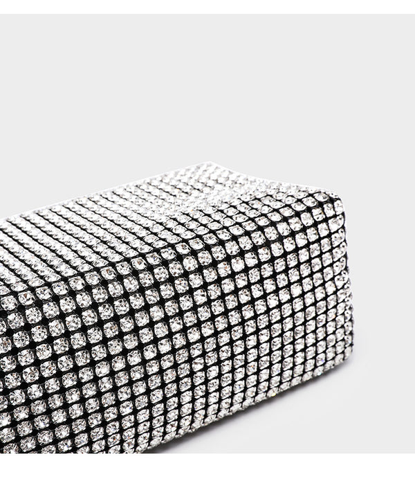Small rectangular all-over rhinestone crossbody bag with pearl bead zipper pull and detachable silver chain strap, detail