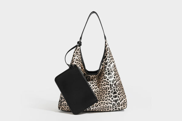 Glossy leopard-print slouchy shoulder bag with long strap and detachable tan zip pouch, detail view 37