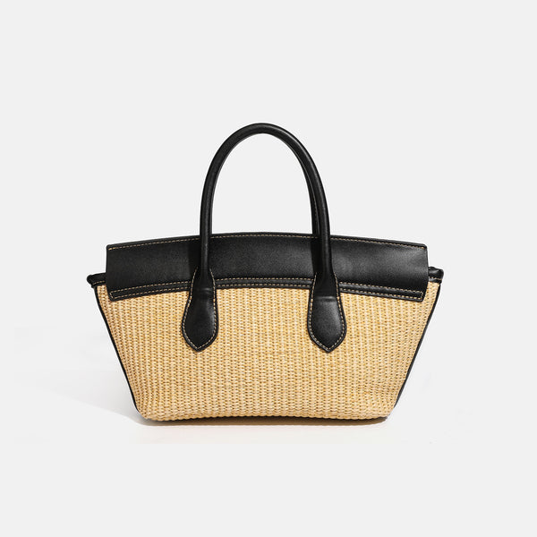 Structured tan woven straw tote bag with black leather-look trim, twin rounded top handles, gold-tone turn-lock front flap