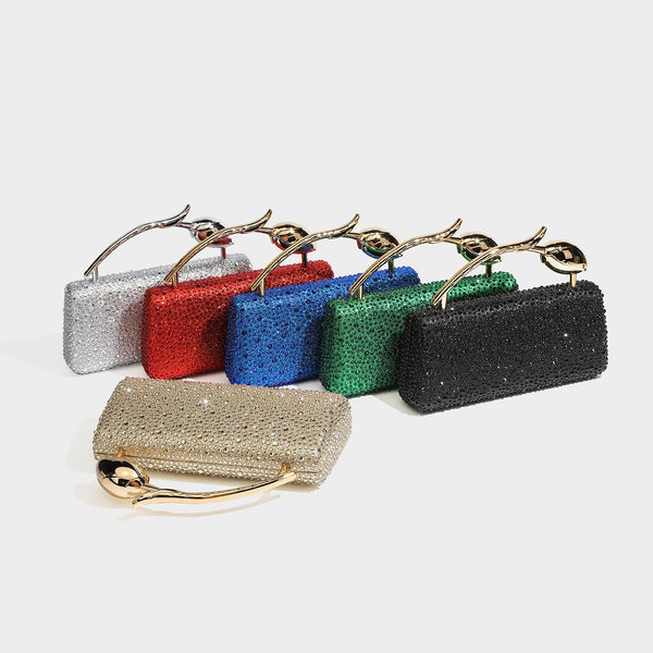 rectangular hard-case rhinestone evening clutch with sculptural gold-tone branch-and-bud top handle and detachable chain