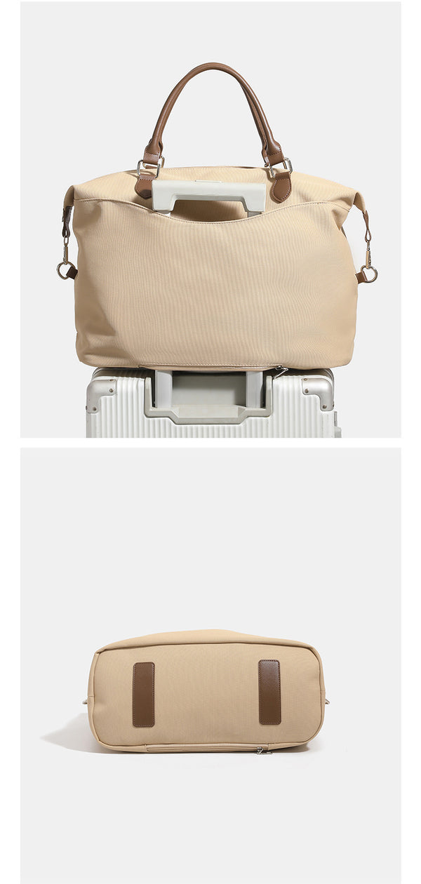 Large slouchy nylon tote bag with brown leather-look handles, double-pull zip closure, and star charm detail, detail view 14