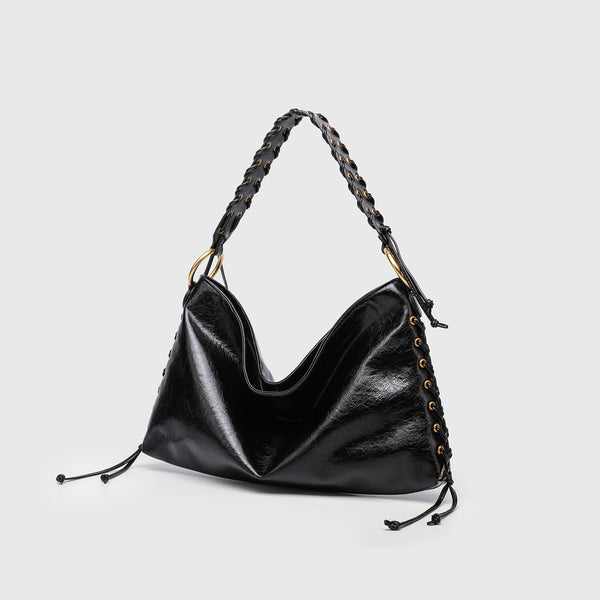 Large slouchy hobo shoulder bag with braided top handle, gold-tone O-ring hardware, and lace-up side cord detailing in