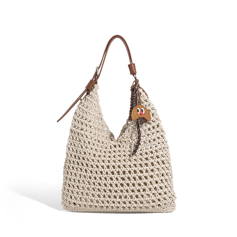 Slouchy open-knit crochet hobo tote bag with leather-look top handle and metal buckle hardware, detail view 5