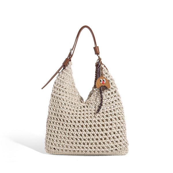 Slouchy open-knit crochet hobo tote bag with leather-look top handle and metal buckle hardware, detail view 5