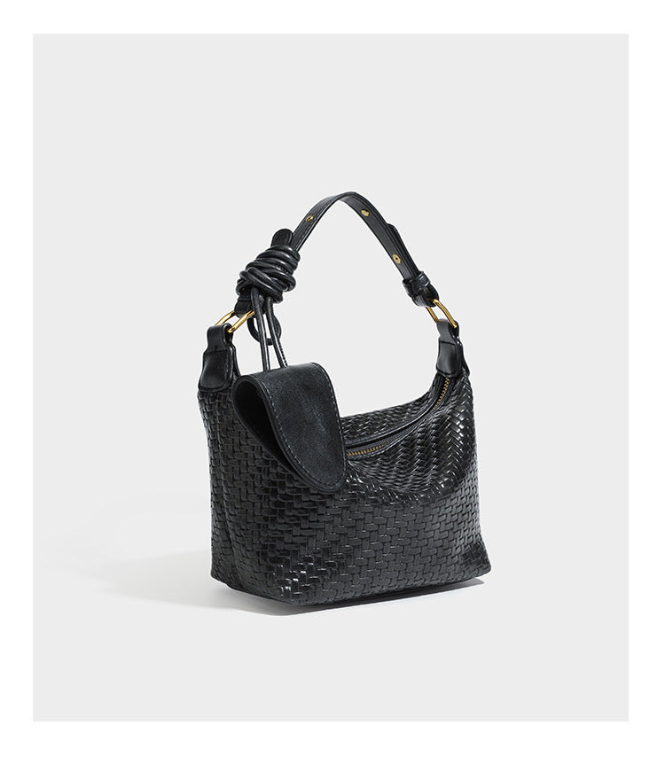 Small glossy basket-weave hobo shoulder bag in brown with knotted top handle, flap accent pocket, and gold-tone hardware