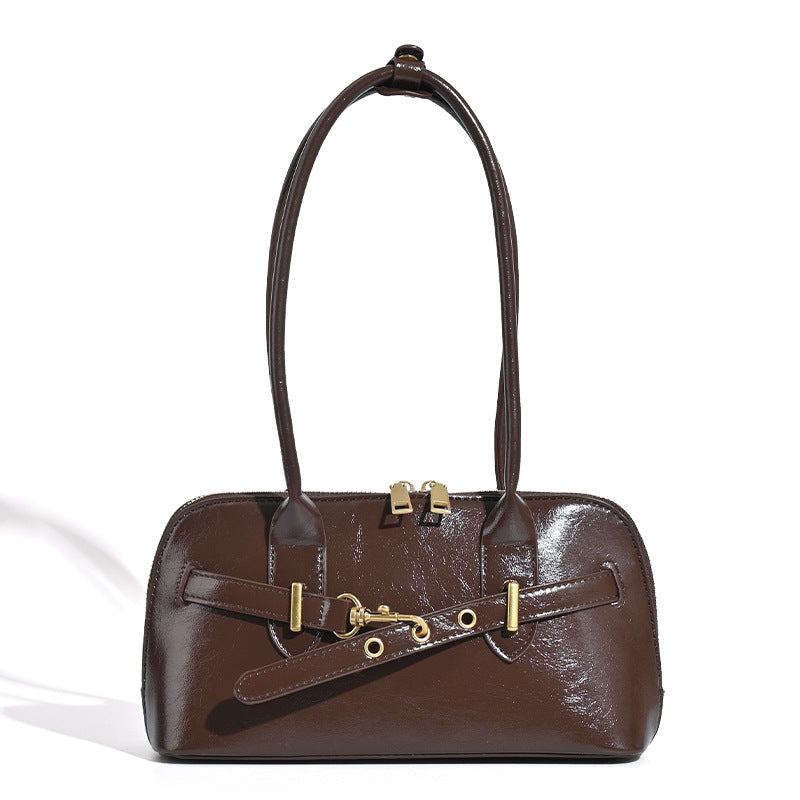 Small structured glossy leather-look shoulder bag with gold-tone buckle hardware and twin top handles, detail view 5