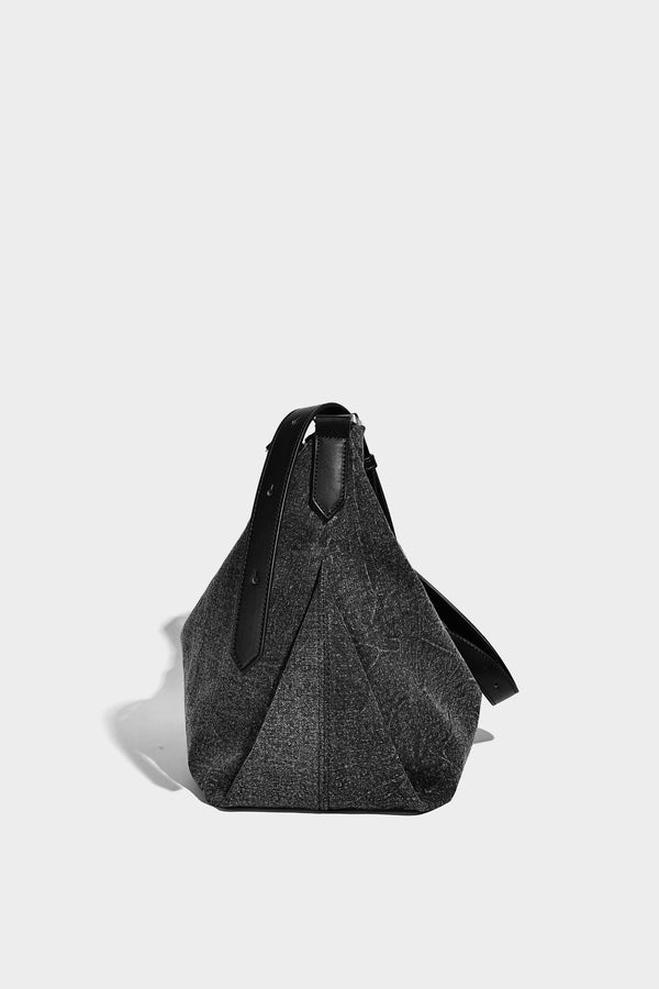 Charcoal denim-textured slouchy hobo bag with zip-top closure, silver-tone hardware, and adjustable leather-look crossbody