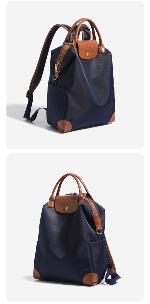 Large matte nylon backpack handbag with cognac leather-look trim, snap flap, and gold-tone hardware, detail view 12