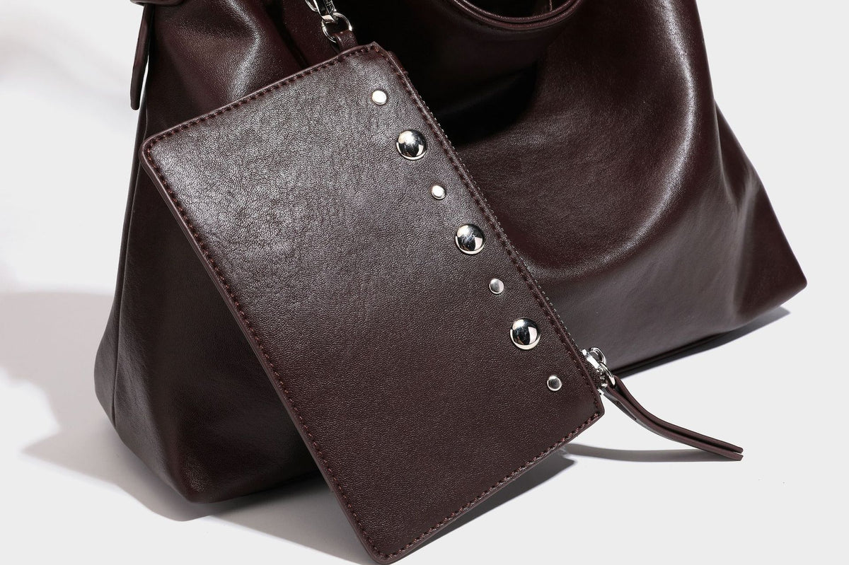 Large slouchy hobo shoulder bag in dark brown with smooth leather-look finish, adjustable strap, and silver-tone hardware