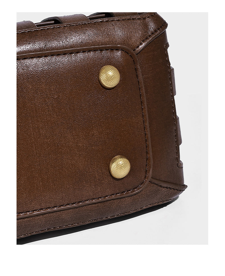 Small structured woven lattice top-handle satchel bag with bead-and-tassel charm and gold-tone hardware, detail view 12