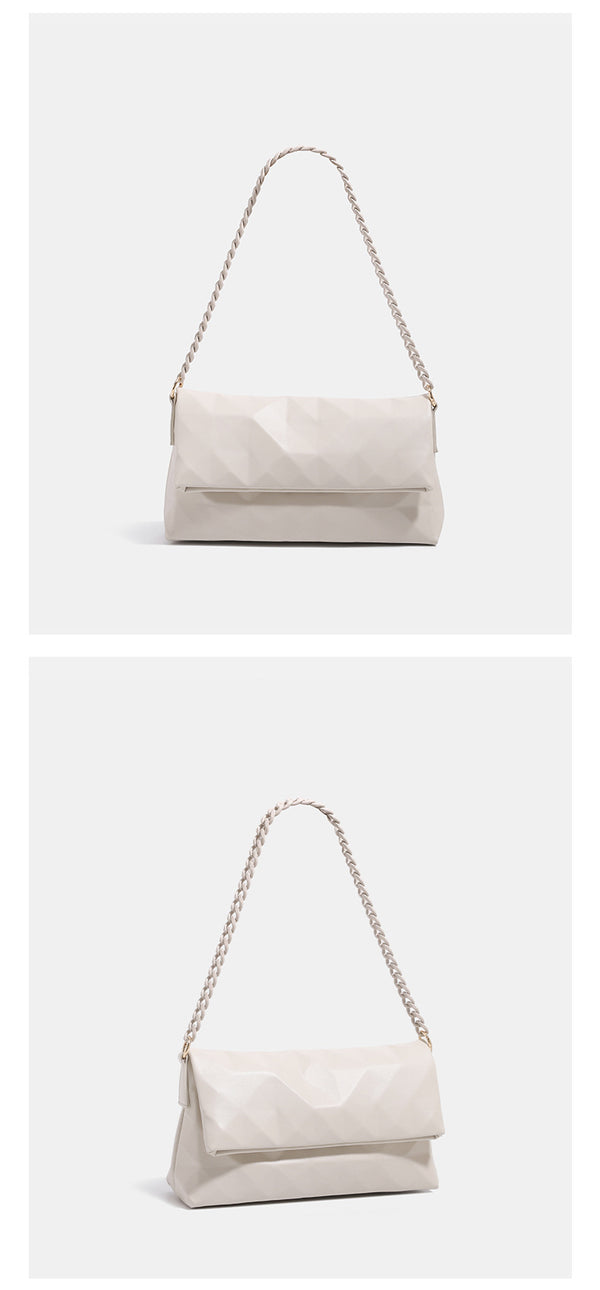Geometric faceted flap shoulder bag with braided chain strap in black and ivory leather-look finish, detail view 9